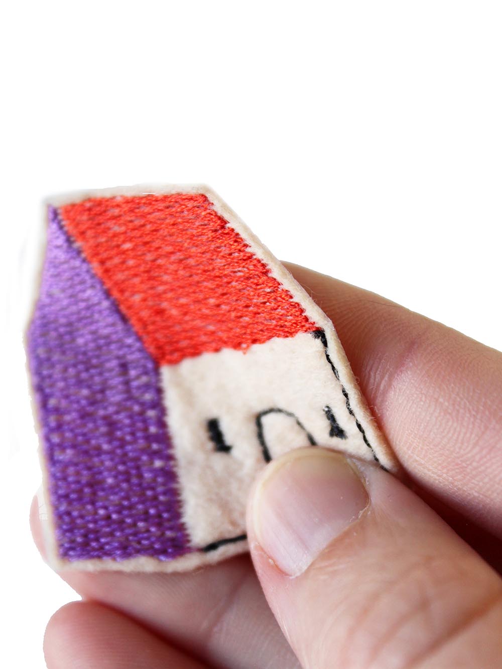 gestickter Aufnäher in der Hand