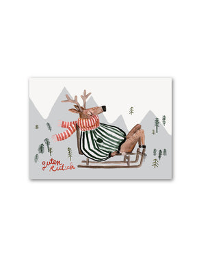 Postkarte Weihnachten guten Rutsch Elch auf Schlitten mit Winterpulli und schal in rot grün