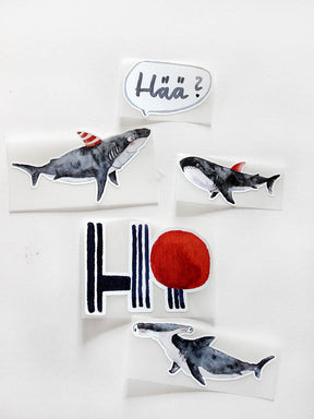 verschiedene Bügelbilder von halfbird, mit dabei haie, hammerhai, ein Hi schriftzug mit rotem Punkt und ein Hää in einer Sprechblase